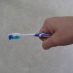 Whole fist tooth brush hold